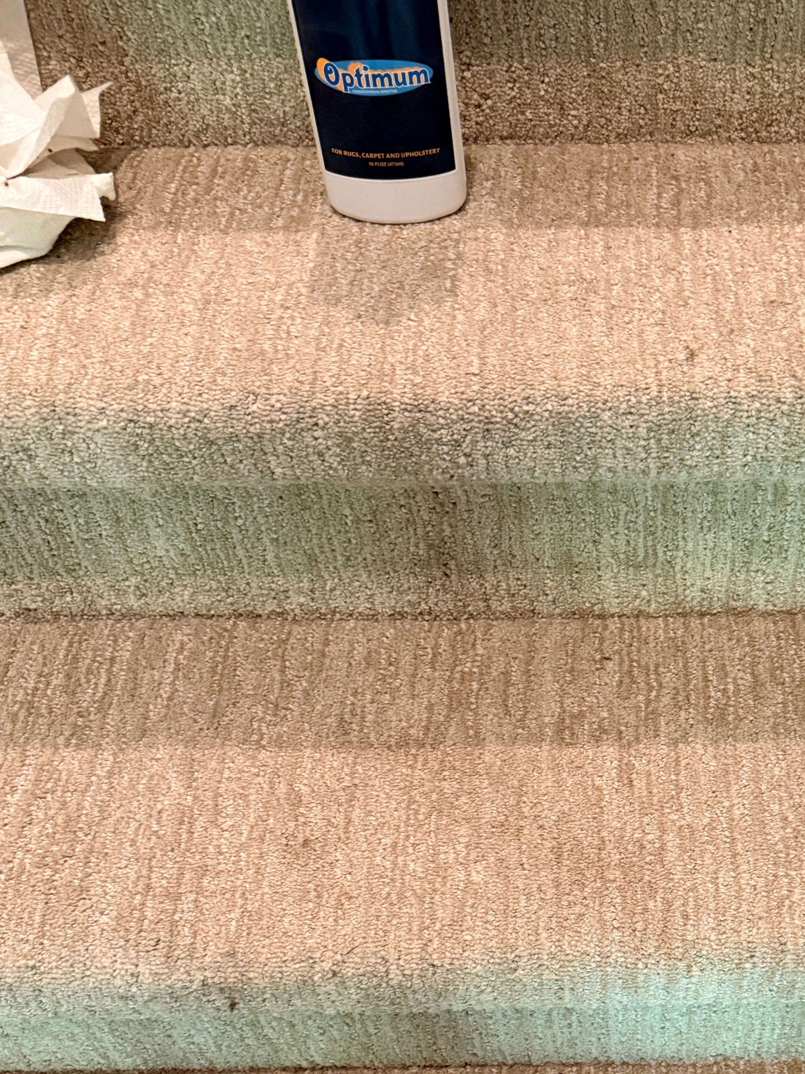 Textured wall panels with a cylindrical object and white fabric on a light blue background